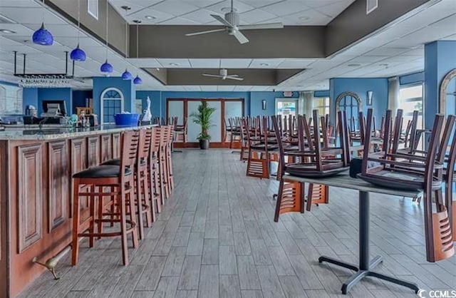 2701 S Ocean Blvd Unit 1507, North Myrtle Beach, SC 29582 - exercise room with a ceiling fan, a paneled ceiling, and wood finished floors