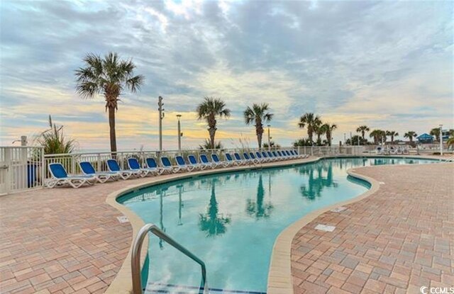 2701 S Ocean Blvd Unit 1507, North Myrtle Beach, SC 29582 - community pool with a patio area and fence