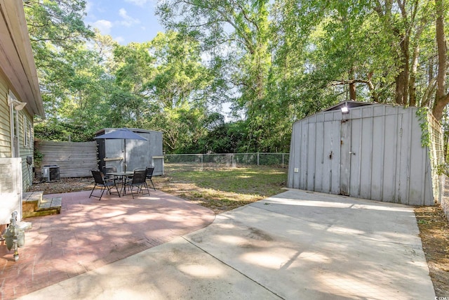 508 Pearl St, Conway, SC 29527 - view of patio / terrace with a fenced backyard, an outdoor structure, a storage unit, and outdoor dining area