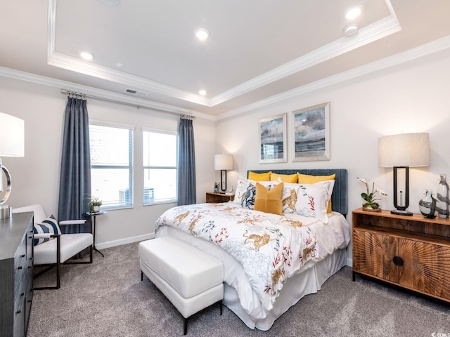 carpeted bedroom featuring visible vents, ornamental molding, a tray ceiling, and recessed lighting