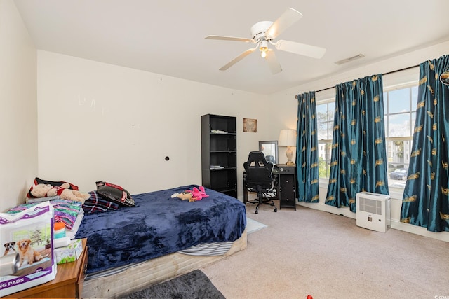 bedroom with a ceiling fan, visible vents, and carpet