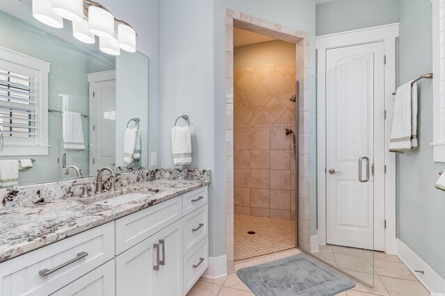 600 Waterbridge Blvd, Myrtle Beach, SC 29579 - bathroom with tile patterned floors, baseboards, vanity, and a shower stall