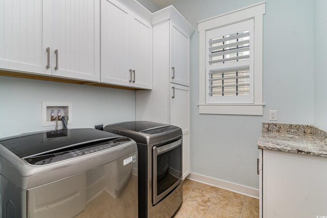 600 Waterbridge Blvd, Myrtle Beach, SC 29579 - washroom with baseboards, cabinet space, and washer and clothes dryer