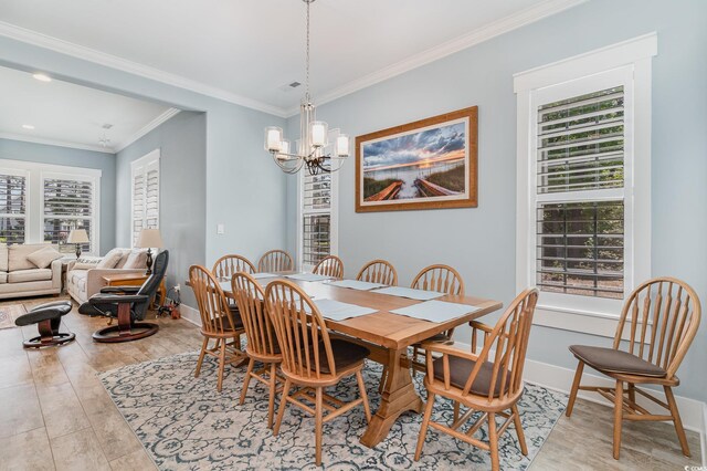 600 Waterbridge Blvd, Myrtle Beach, SC 29579 - dining space featuring baseboards, light wood-style floors, a notable chandelier, and crown molding