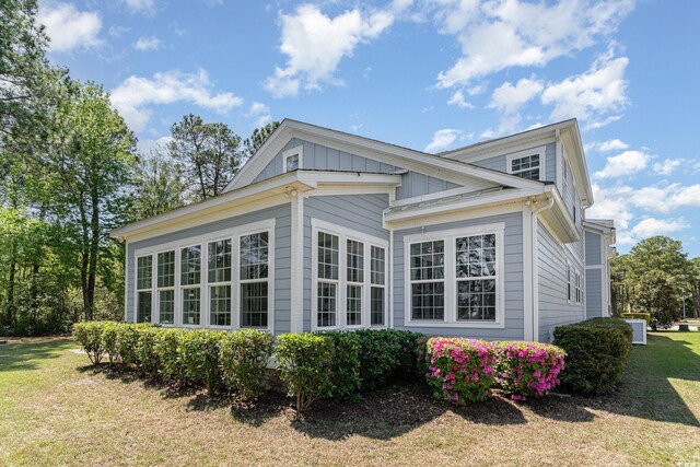 600 Waterbridge Blvd, Myrtle Beach, SC 29579 - view of home's exterior with a yard and board and batten siding