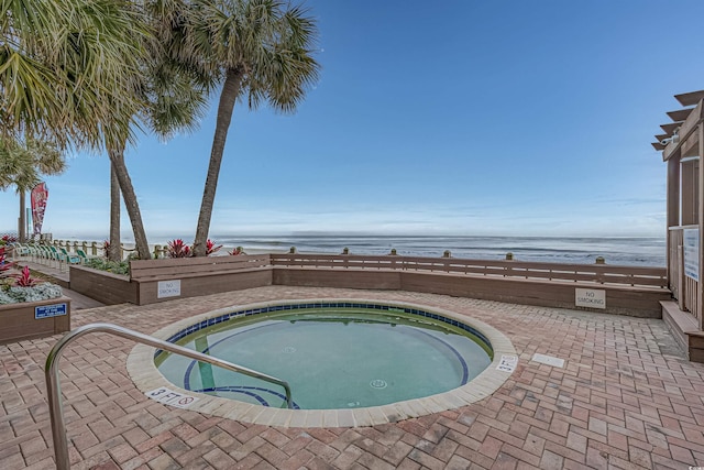 1012 N Waccamaw Dr Unit 507, Murrells Inlet, SC 29576 - view of pool with a water view, a patio, and a hot tub