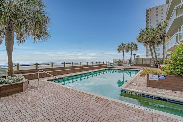 1012 N Waccamaw Dr Unit 507, Murrells Inlet, SC 29576 - community pool featuring a water view and a patio area