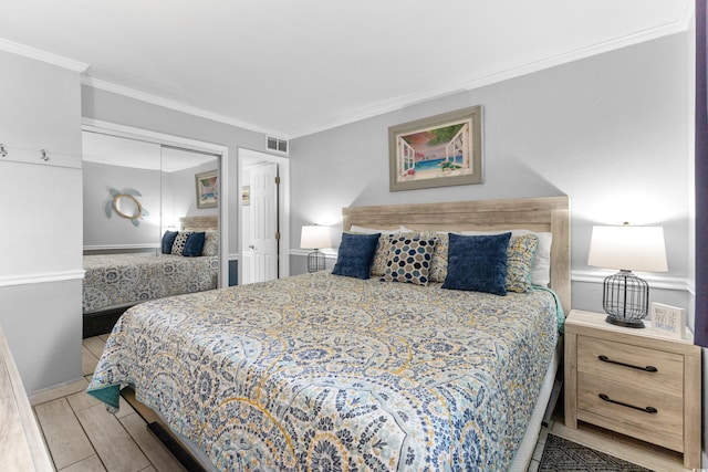 1012 N Waccamaw Dr Unit 507, Murrells Inlet, SC 29576 - bedroom featuring ornamental molding, a closet, wood finished floors, and baseboards