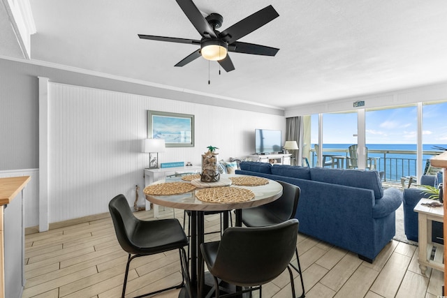 1012 N Waccamaw Dr Unit 507, Murrells Inlet, SC 29576 - dining room featuring a ceiling fan, crown molding, wood tiled floors, and plenty of natural light
