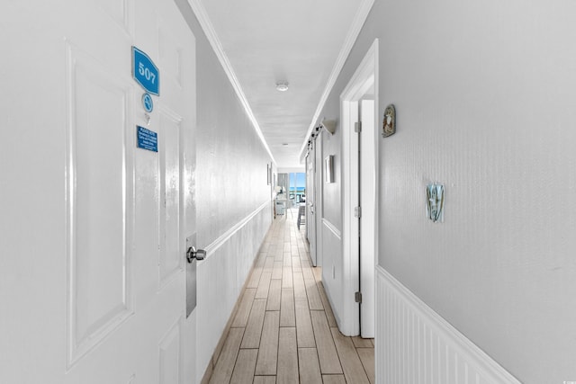 1012 N Waccamaw Dr Unit 507, Murrells Inlet, SC 29576 - hallway with crown molding, light wood-style floors, and a wainscoted wall