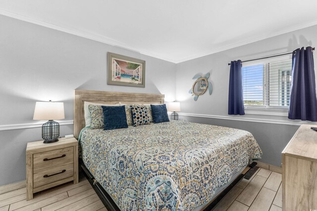 1012 N Waccamaw Dr Unit 507, Murrells Inlet, SC 29576 - bedroom featuring wood finish floors, ornamental molding, and baseboards