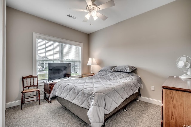 bedroom featuring ceiling fan, baseboards, visible vents, and carpet