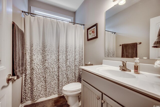 377 Copperwood Loop, Conway, SC 29526 - bathroom with toilet, vanity, and a shower with shower curtain
