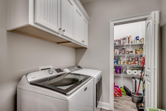 377 Copperwood Loop, Conway, SC 29526 - washroom featuring washer and dryer, light wood-style flooring, and cabinet space