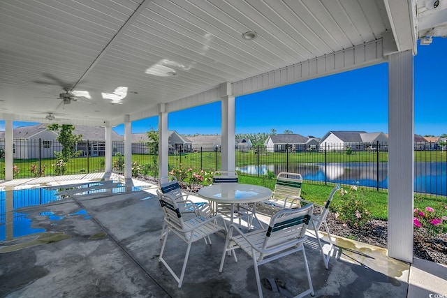 view of patio / terrace with a residential view, a ceiling fan, a fenced backyard, and outdoor dining area