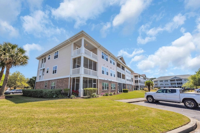 view of building exterior featuring uncovered parking