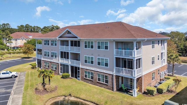 view of property with uncovered parking