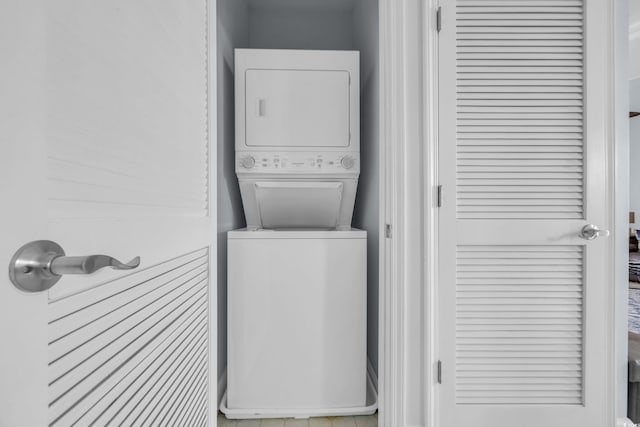 laundry room with estacked washer and dryer
