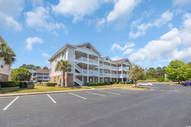 view of property with uncovered parking