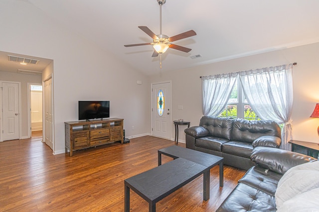 living room featuring a ceiling fan, visible vents, lofted ceiling, and wood finished floors