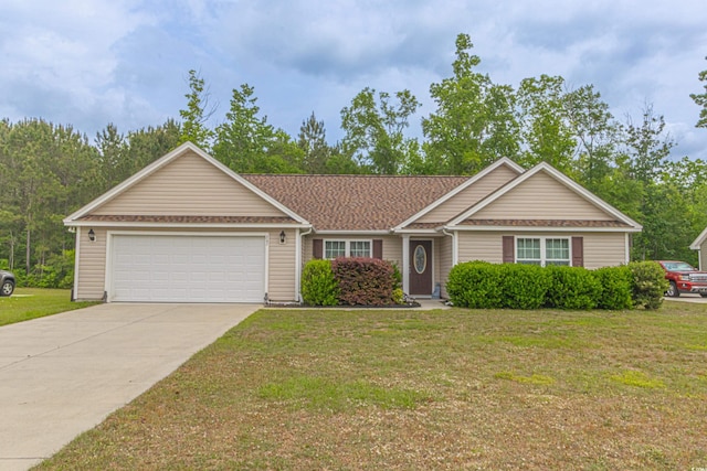 ranch-style house with a garage, a front lawn, and driveway
