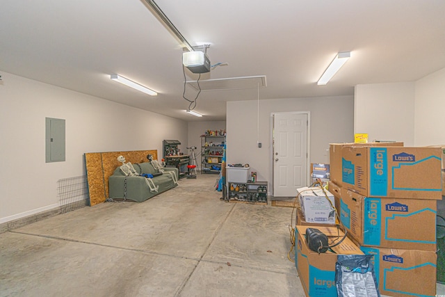 garage featuring electric panel and a garage door opener