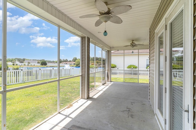 197 Northside Dr, Little River, SC 29566 - unfurnished sunroom featuring a ceiling fan and a water view