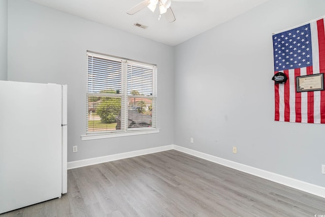 197 Northside Dr, Little River, SC 29566 - unfurnished room with a ceiling fan, visible vents, wood finished floors, and baseboards