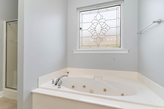 197 Northside Dr, Little River, SC 29566 - bathroom featuring a shower stall, tile patterned flooring, and a jetted tub