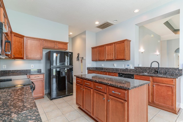 197 Northside Dr, Little River, SC 29566 - kitchen featuring a sink, visible vents, a kitchen island, black appliances, and light tile patterned flooring