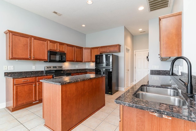 197 Northside Dr, Little River, SC 29566 - kitchen featuring dark stone counters, black appliances, a sink, and visible vents