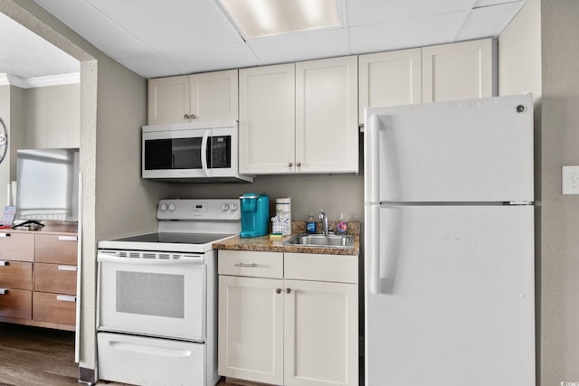 6900 Ocean Blvd N Unit 1114, Myrtle Beach, SC 29572 - kitchen with white appliances, white cabinets, wood finished floors, a drop ceiling, and crown molding
