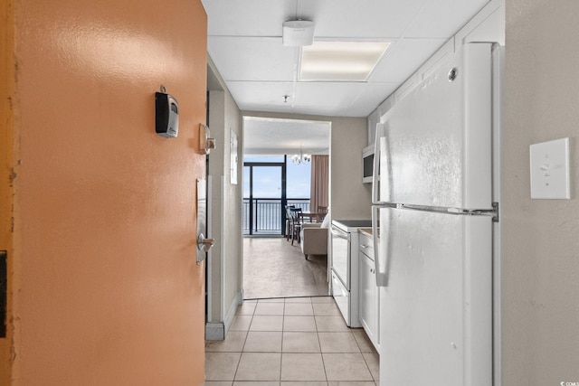 6900 Ocean Blvd N Unit 1114, Myrtle Beach, SC 29572 - corridor featuring light tile patterned floors and a chandelier