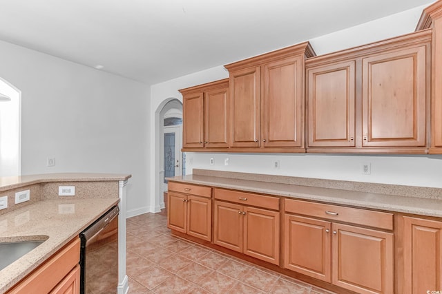 178 Kessinger Dr, Surfside Beach, SC 29575 - kitchen featuring dishwasher, arched walkways, light tile patterned flooring, a sink, and light stone countertops