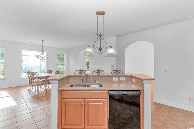 178 Kessinger Dr, Surfside Beach, SC 29575 - kitchen with dishwasher, a sink, arched walkways, light tile patterned flooring, and pendant lighting