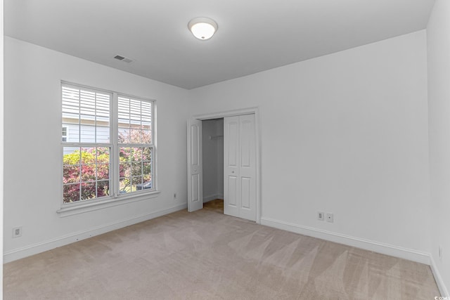 178 Kessinger Dr, Surfside Beach, SC 29575 - unfurnished bedroom with light colored carpet, baseboards, and a closet