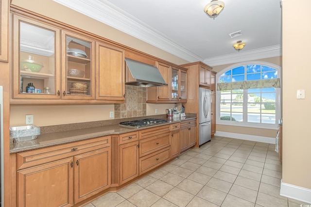 178 Kessinger Dr, Surfside Beach, SC 29575 - kitchen featuring wall chimney range hood, stainless steel appliances, baseboards, crown molding, and glass insert cabinets