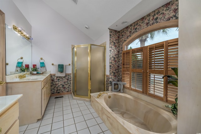 full bathroom featuring vanity, a garden tub, tile patterned floors, a shower stall, and vaulted ceiling