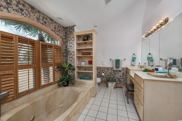 bathroom featuring a bath, toilet, wallpapered walls, and tile patterned flooring