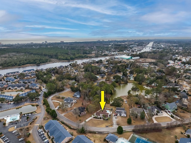 birds eye view of property with a water view