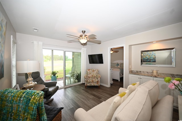 living area featuring ceiling fan, baseboards, dark wood-type flooring, and visible vents