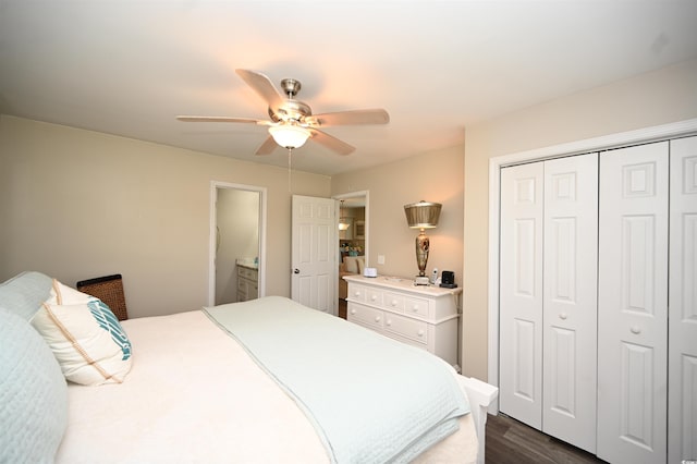 bedroom with dark wood finished floors, a closet, and ceiling fan