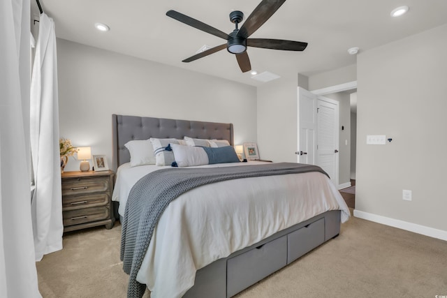 bedroom with light colored carpet, recessed lighting, a ceiling fan, and baseboards