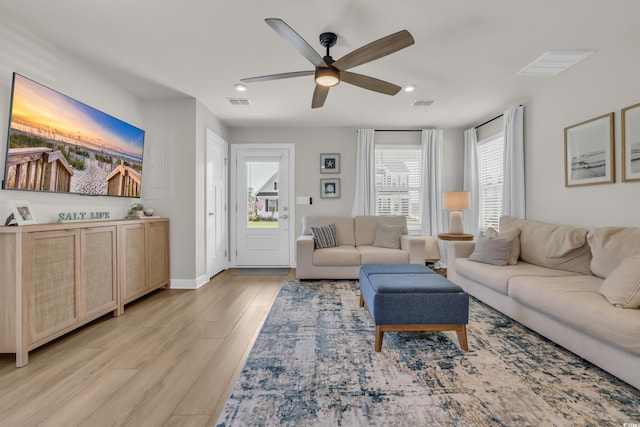 living area with ceiling fan, light wood-style flooring, recessed lighting, and baseboards