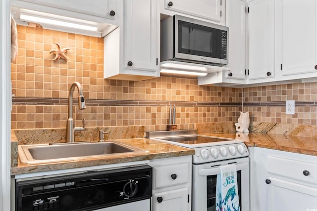 kitchen with dishwashing machine, electric stove, white cabinetry, stainless steel microwave, and a sink