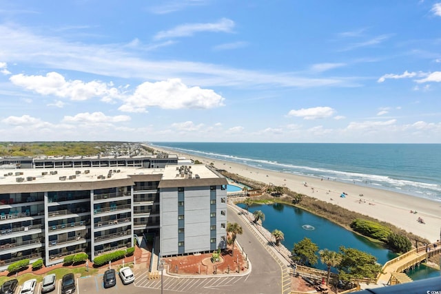 bird's eye view with a water view and a view of the beach