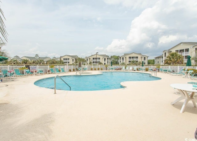 201 Landing Rd Unit D, North Myrtle Beach, SC 29582 - pool featuring fence, a patio area, and a residential view