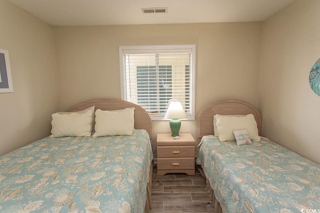 201 Landing Rd Unit D, North Myrtle Beach, SC 29582 - bedroom with visible vents and wood finished floors