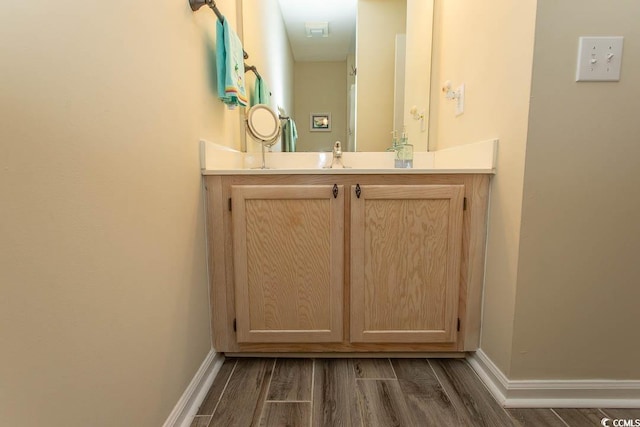 201 Landing Rd Unit D, North Myrtle Beach, SC 29582 - bathroom with vanity, wood finished floors, and baseboards