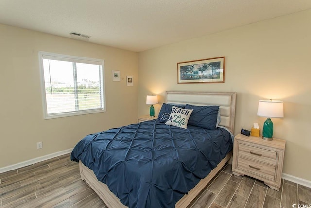 201 Landing Rd Unit D, North Myrtle Beach, SC 29582 - bedroom featuring baseboards, visible vents, and wood finish floors